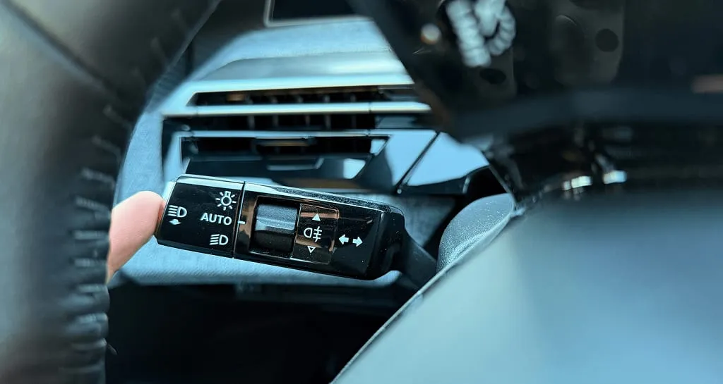 The button to change the instrument cluster view is hidden on the stalk